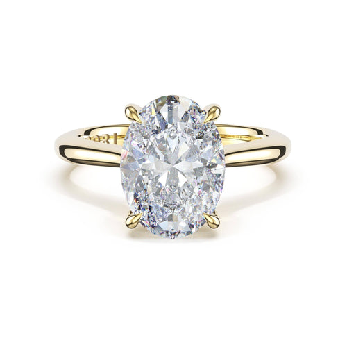 Oval-cut lab-grown diamond engagement ring in yellow gold at Everett Jewelry in Shreveport.